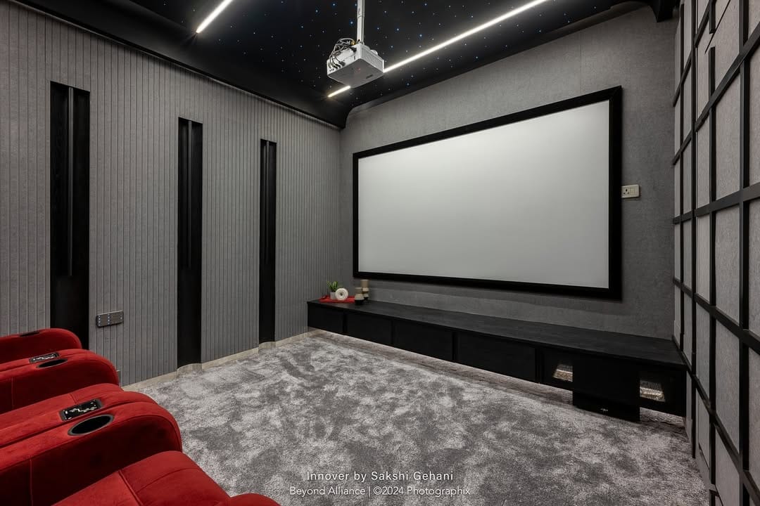 Luxury media room with hidden display and integrated audio by Beyond Alliance