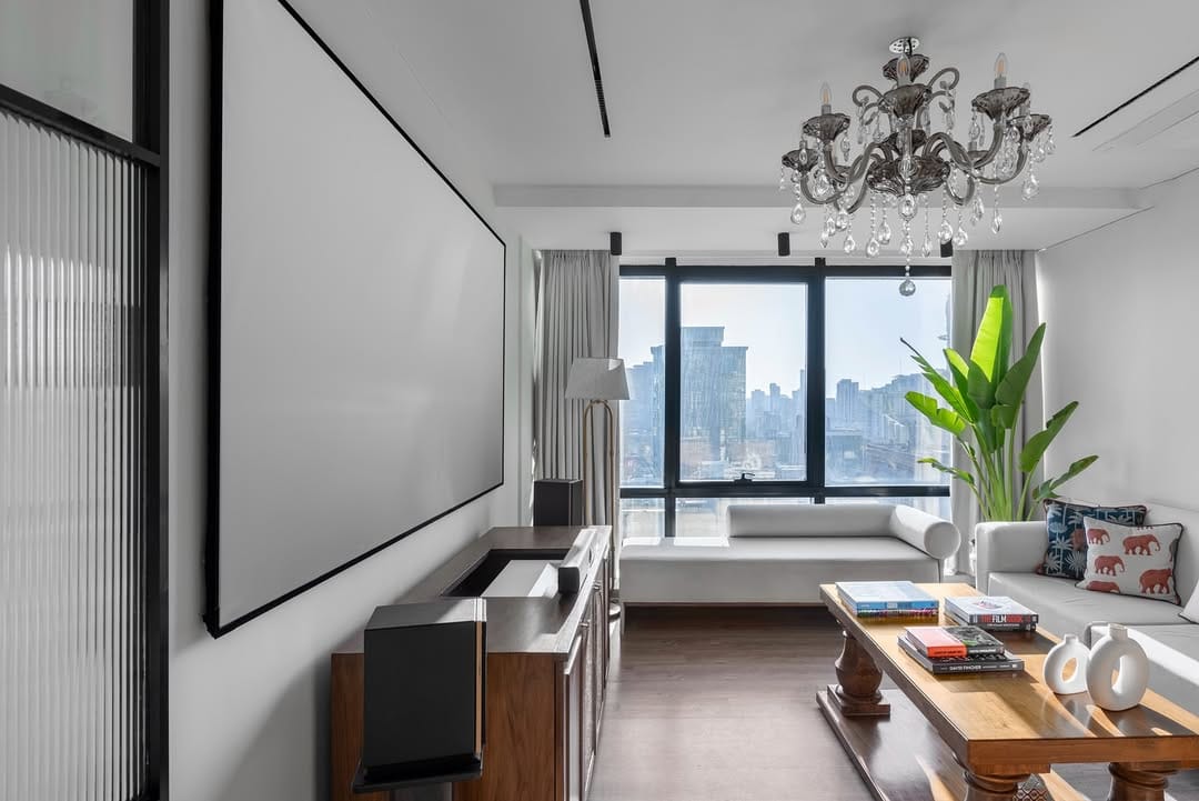 Luxury media room with hidden display and integrated audio by Beyond Alliance.